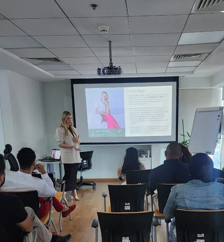 Beth Clay delivering a financial wellbeing workshop to a room of employees